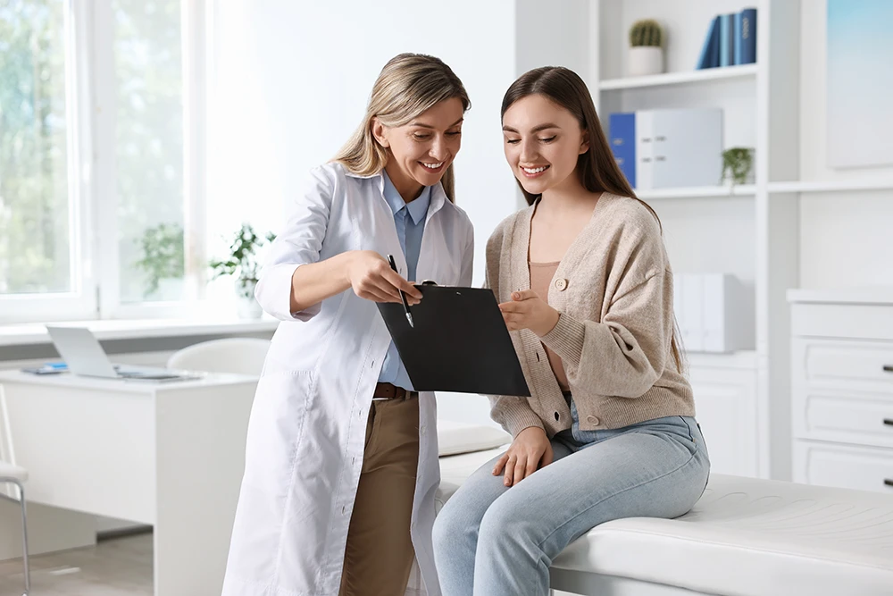 Woman's Guide - Fox Valley Medical Associates woman doctor with woman patient